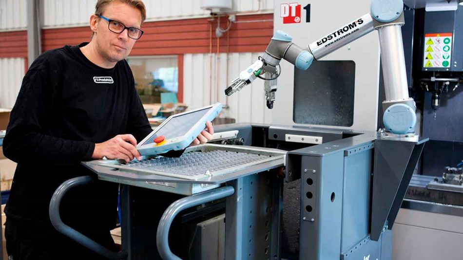 Man in front of collaborative robot solution