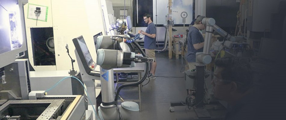 Automation experts programming collaborative robots