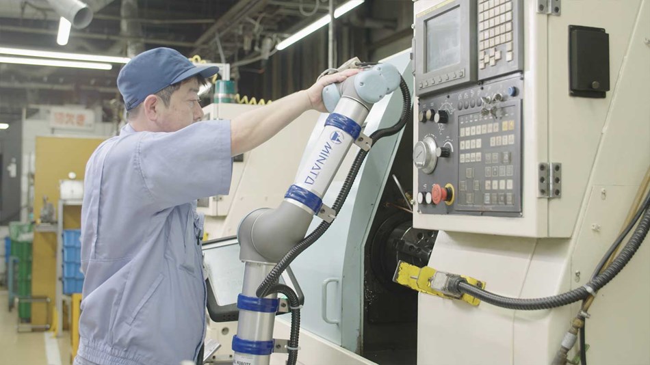 Cobots next to CNC machine