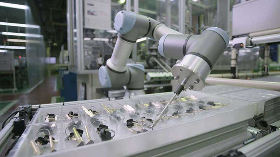 Alpha Corporation in Japan first considered deploying industrial robots to tend injection molding machines but abandoned the idea since the company did not have enough space to erect safety fencing.