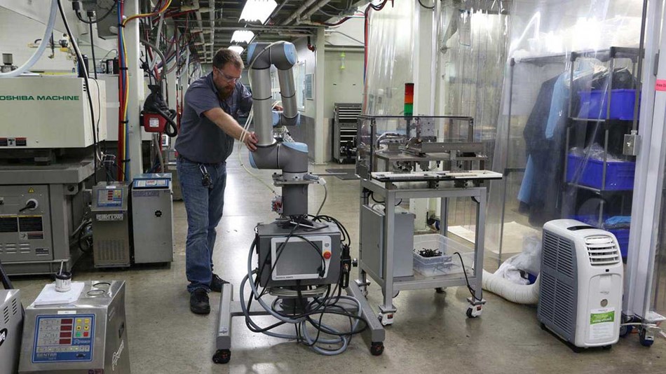Cobots can easily be moved from press to press, as seen here at Dynamic Group.